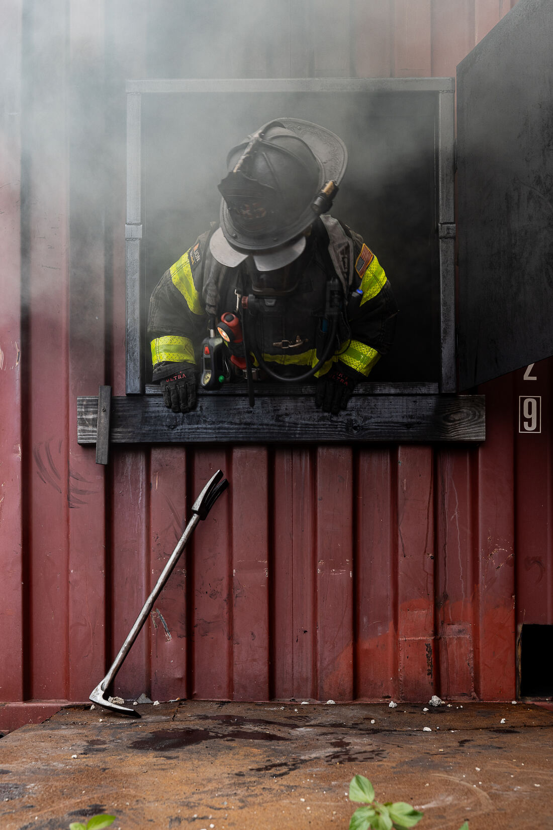 Turnout gear hanging in rows at a fire station